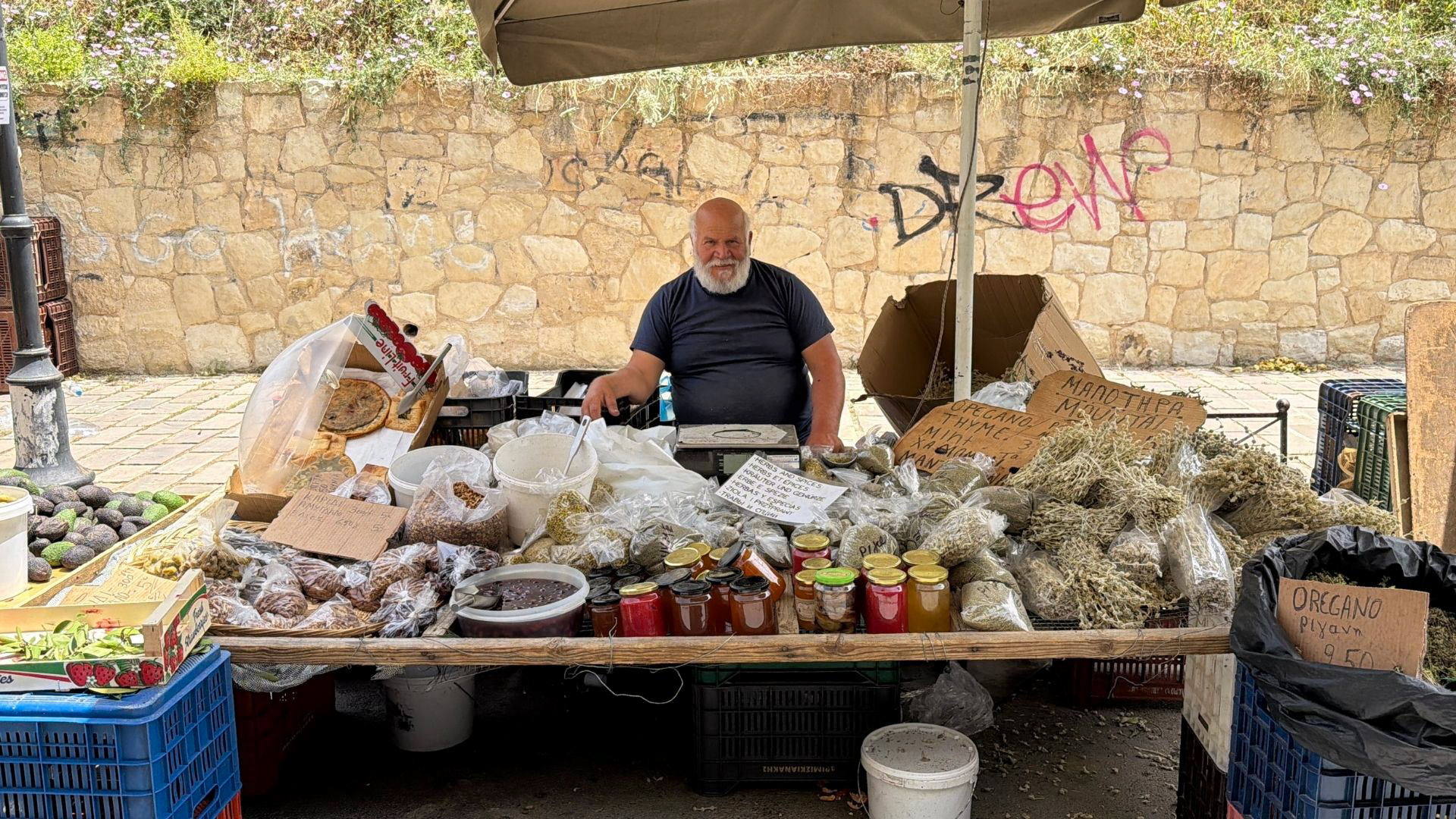 Local vendor selling mountain herbs, honey and spices at Chania Saturday farmers market, Crete Local vendor selling mountain herbs, honey and spices at Chania Saturday farmers market, Crete