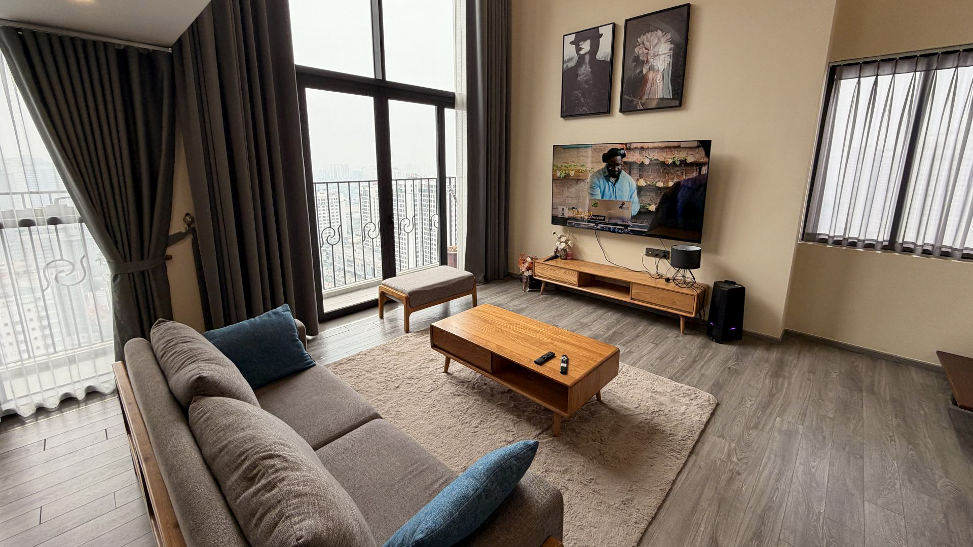 Bright penthouse apartment in Hanoi West Lake area featuring large windows, city views, comfortable lounge area and modern interior. Bright penthouse apartment in Hanoi West Lake area featuring large windows, city views, comfortable lounge area and modern interior.