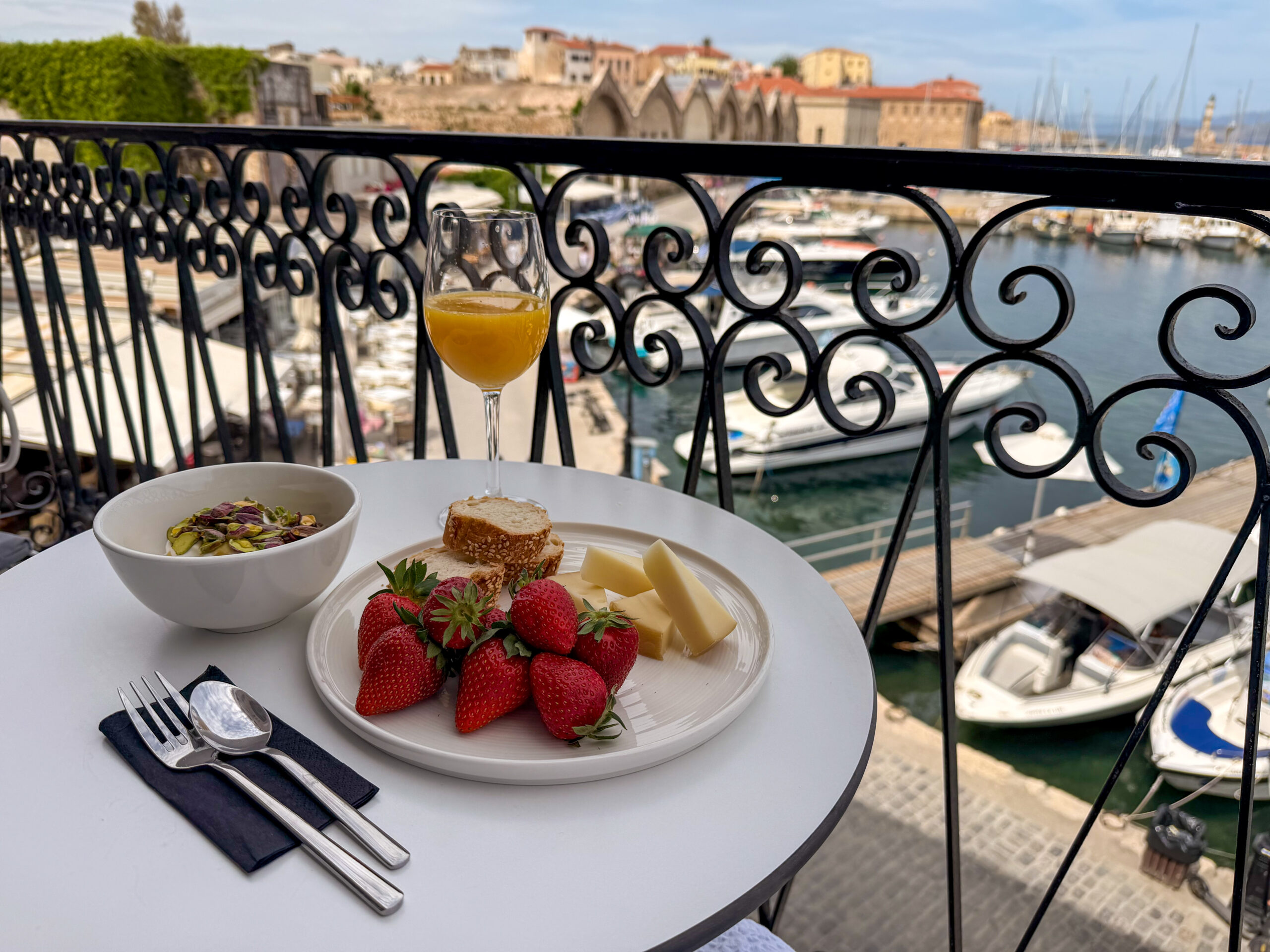 Breakfast on the balcony at Riviera Suites Chania with harbour view
