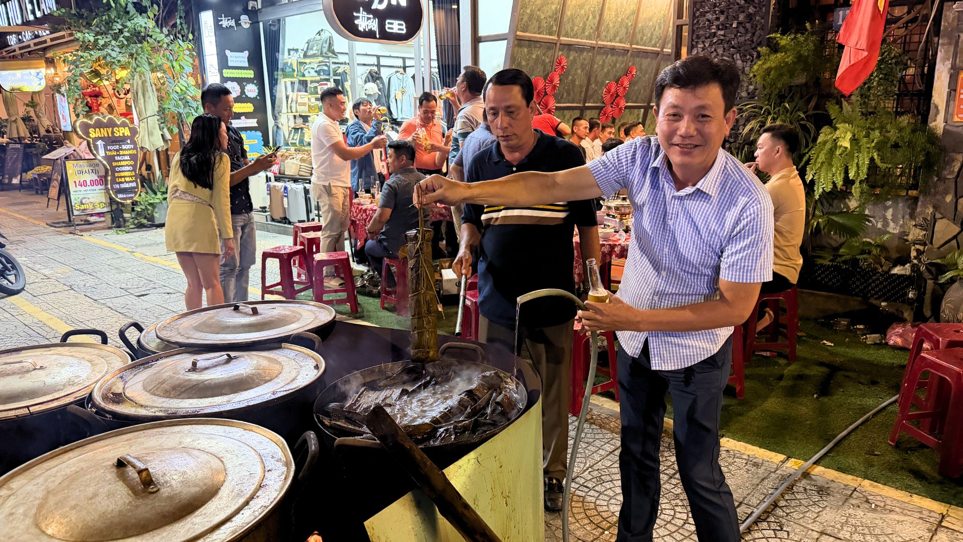 Traditional Vietnamese Tet food being prepared by locals during Lunar New Year celebrations in Da Nang, Vietnam. Traditional Vietnamese Tet food being prepared by locals during Lunar New Year celebrations in Da Nang, Vietnam.