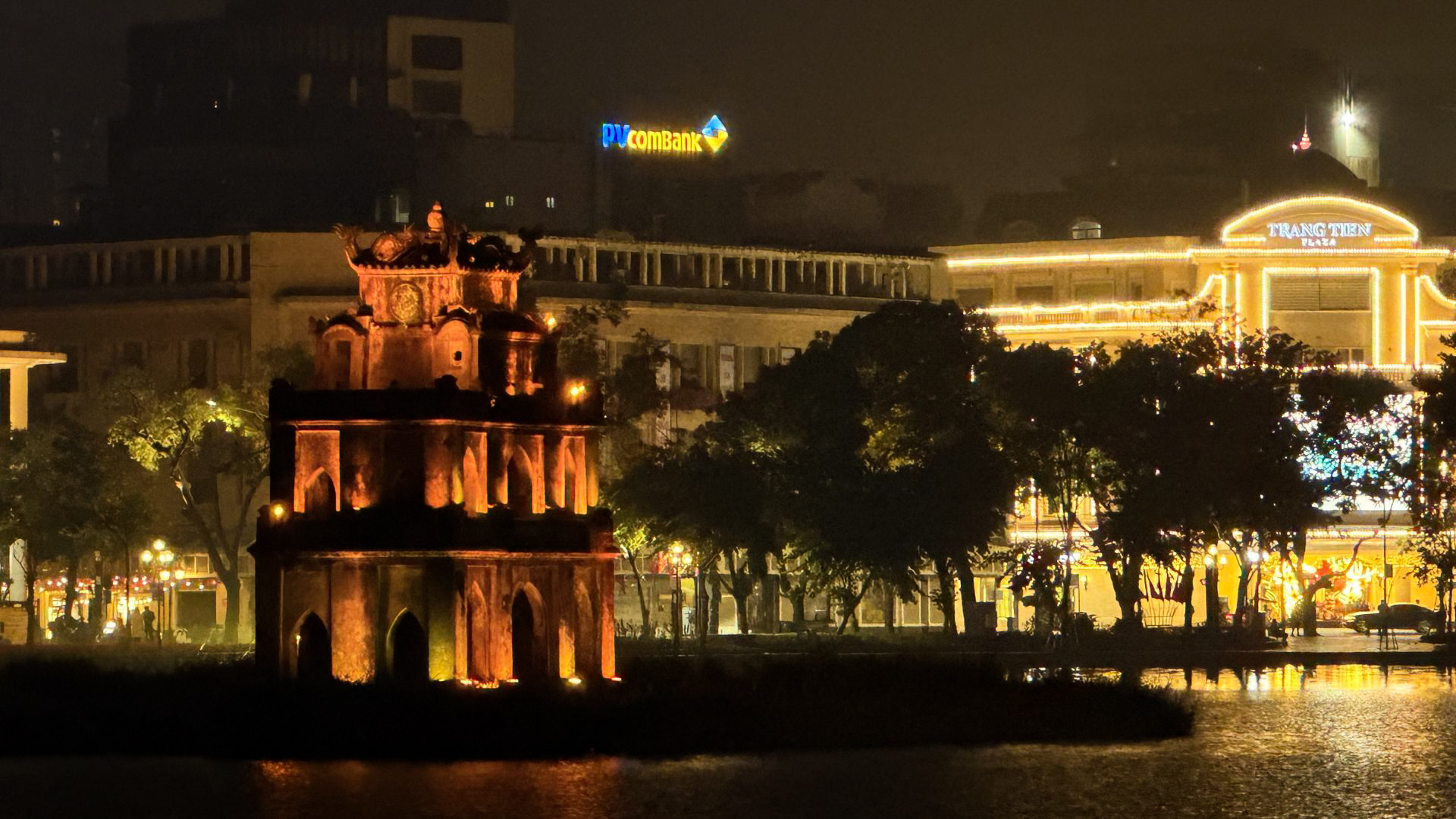 Turtle Tower illuminated at night on Hoan Kiem Lake in Hanoi, Vietnam. Turtle Tower illuminated at night on Hoan Kiem Lake in Hanoi, Vietnam.