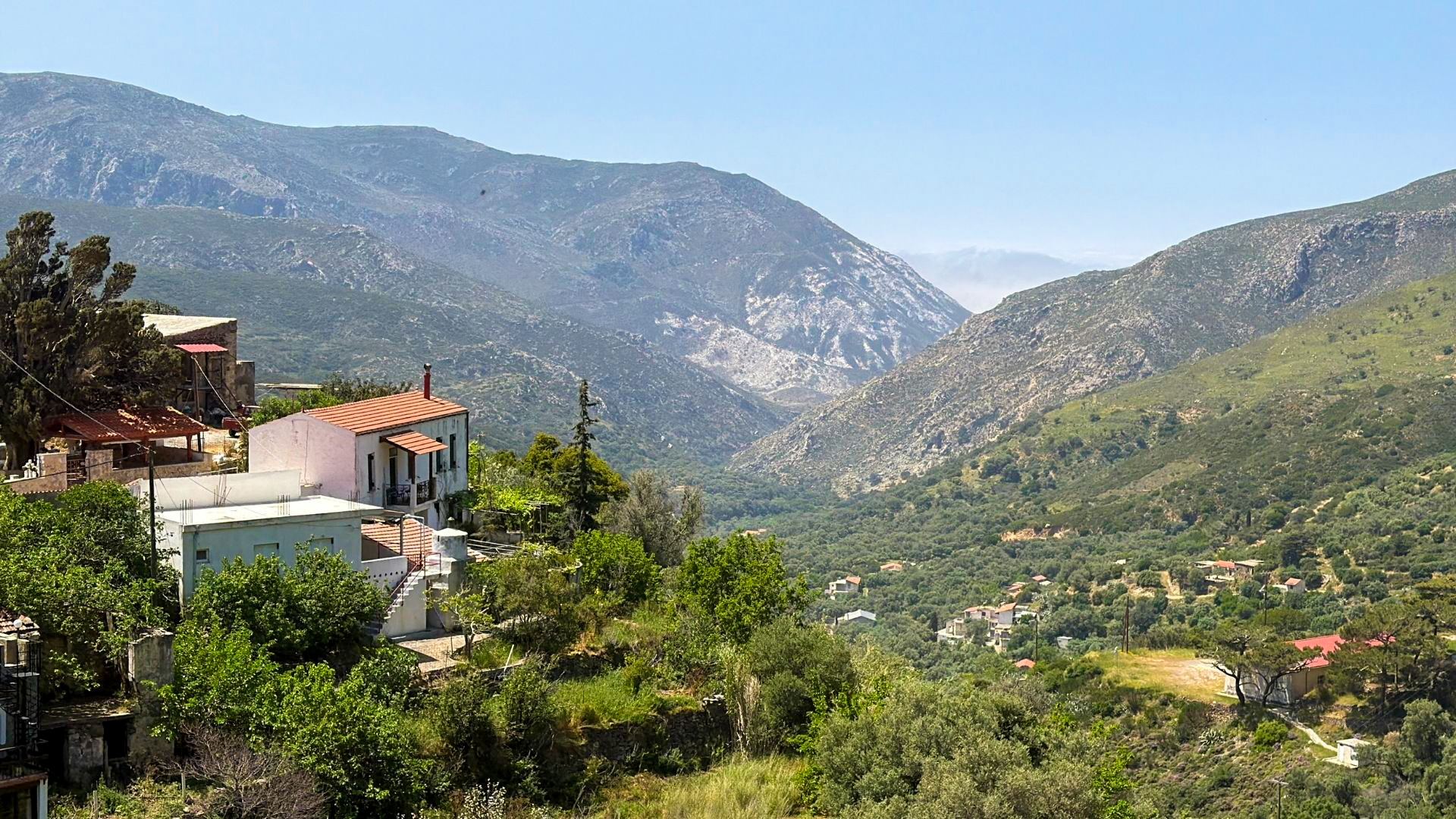 Mountain village with valley and White Mountains of Crete in the background Mountain village with valley and White Mountains of Crete in the background
