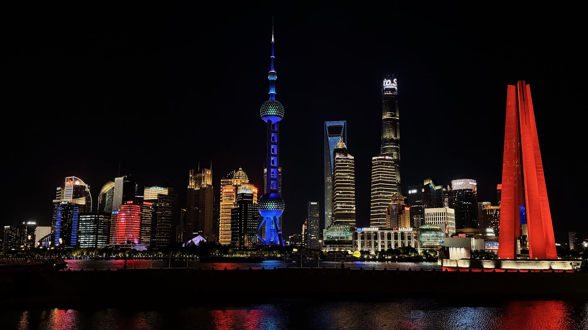 Pudong skyline lit up at night, seen from the Bund in Shanghai